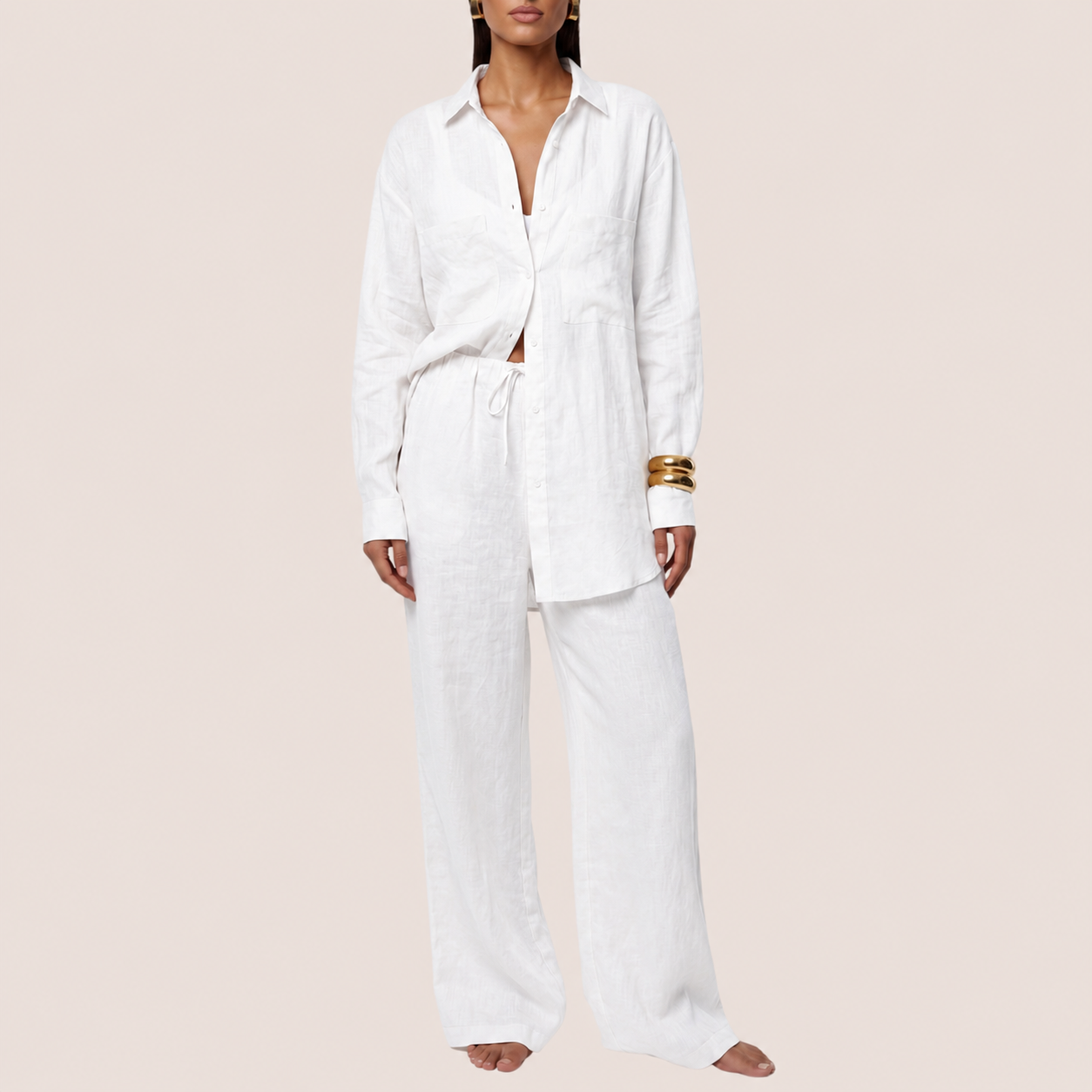 Women's white linen two-piece set with drawstring wide leg pants, front view showing hemline and linen fabric texture detail
