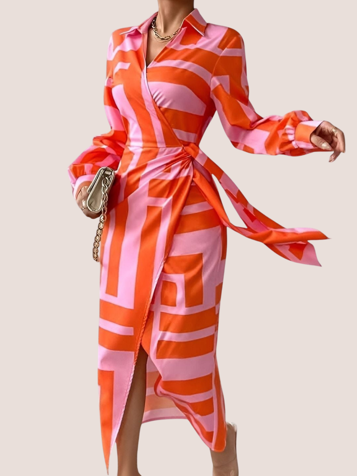 Pink orange wrap midi dress showing tie waist and flared skirt