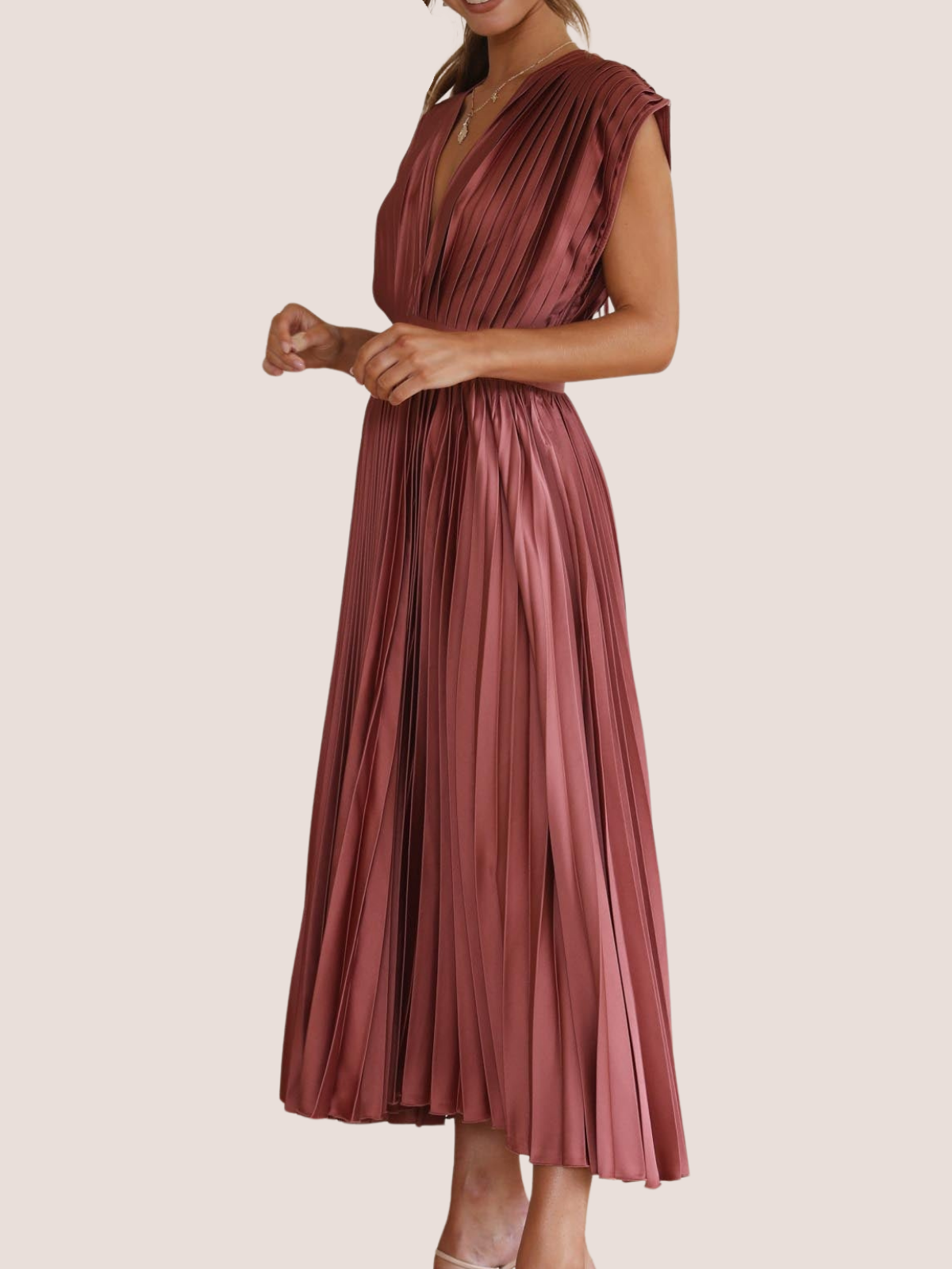 Women's summer wedding guest midi dress, side view of pleated detail
