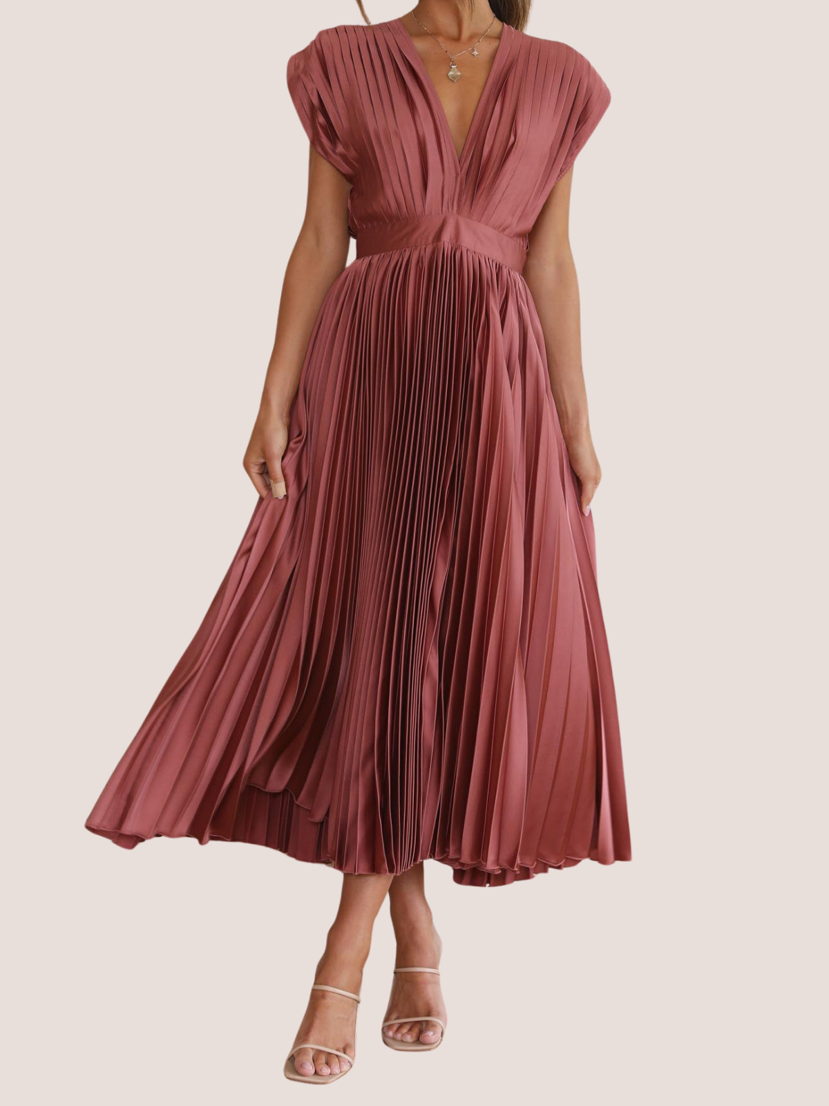 Pleated formal midi dress for women, showing flowy skirt movement