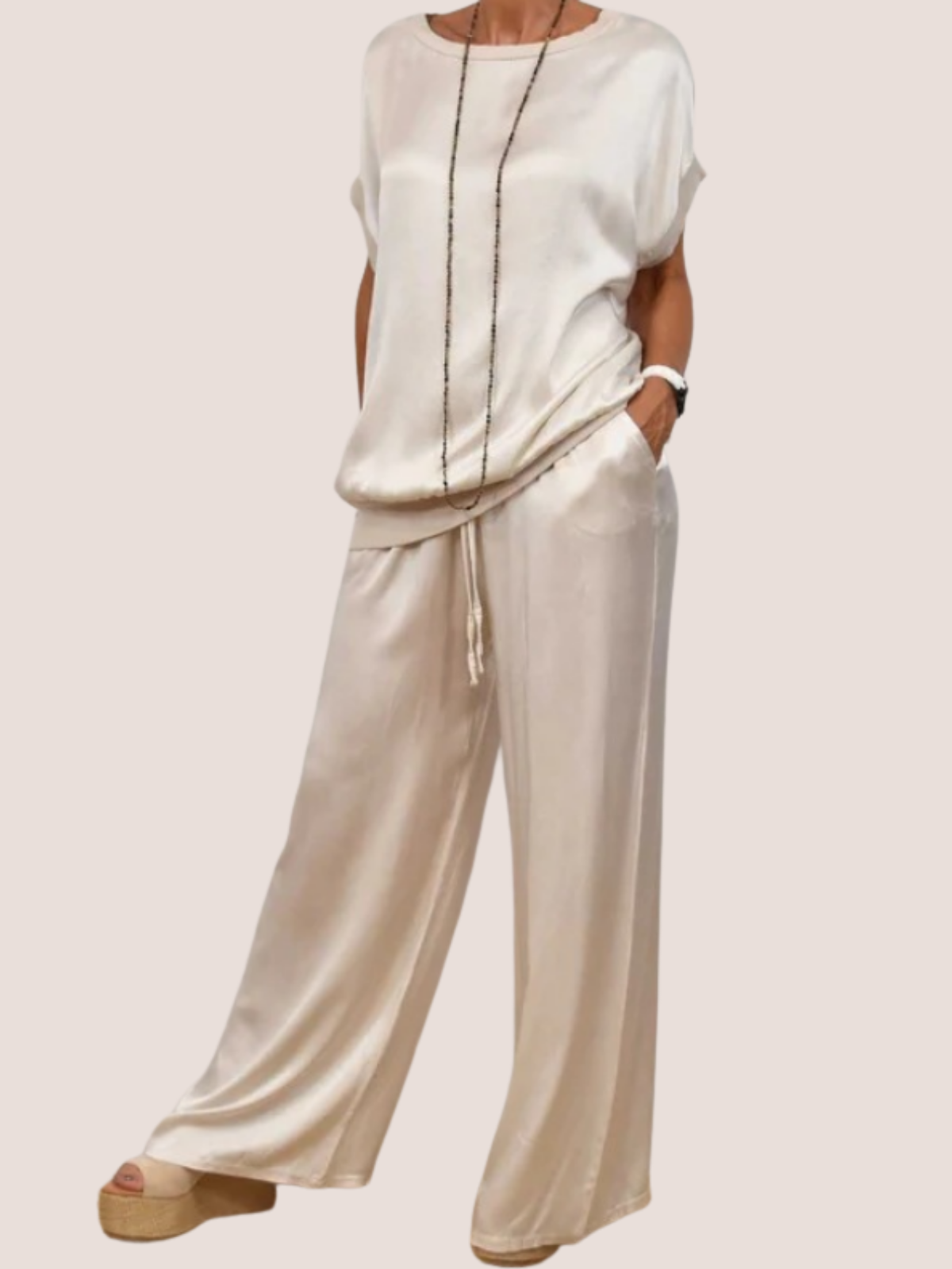 Two-piece vacation set with satin top and wide leg pants, styled look